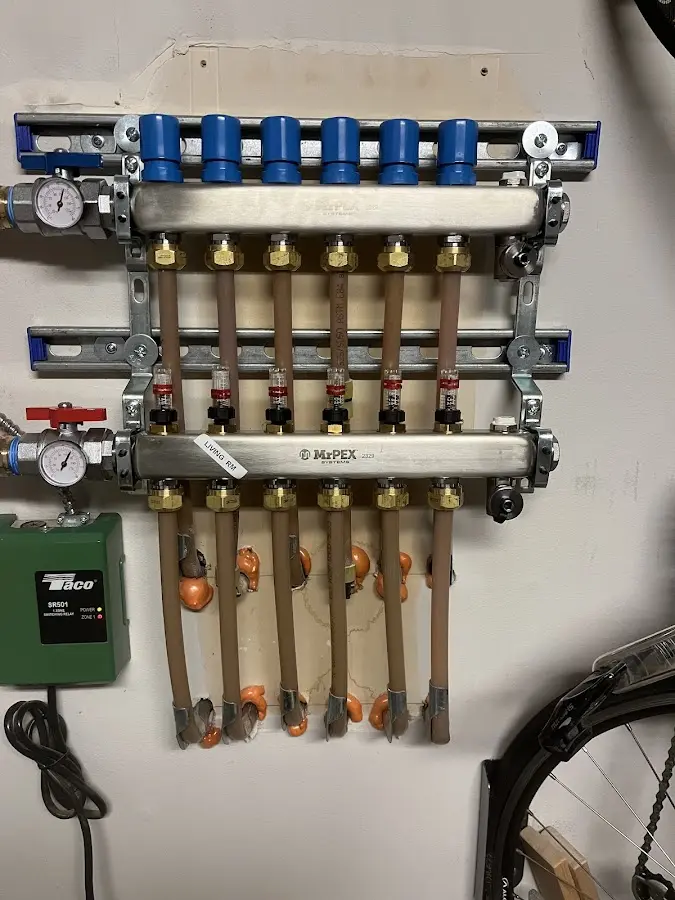 Plumber performing Water Heater Repair at a residential property in East End